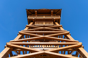 Wooden observation tower in forest clearing