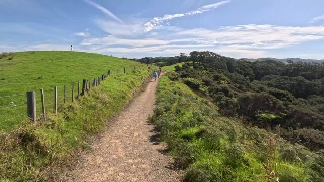 Matapouri Bay New Zealand Family Walking On Trail Near Coast