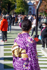 Women wearing a purple kimono.