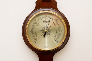 Close up of the face of an aneroid barometer
