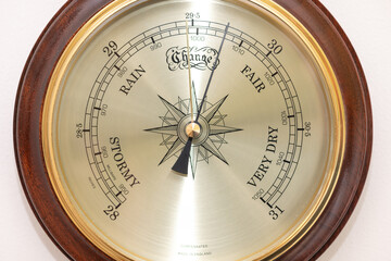 Close up of the face of an aneroid barometer