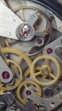Cogwheels inside clockwork. Close-up. Concept Eternity, Teamwork , Idea Technology. Tick-Tick Sound