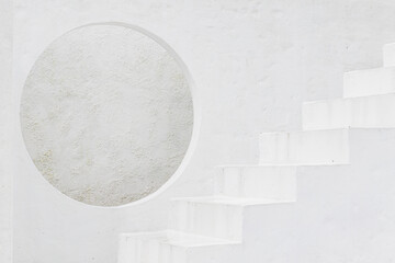 Modern Circular window Opening with Textured White Walls and Stairs