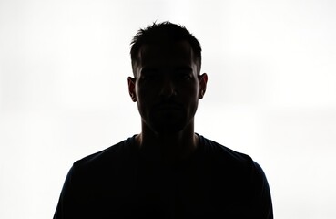 Silhouette of man. Serious male figure. Isolated against white background. Head, shoulders. Mystery, anonymity. Could used in various contexts like social media profiles, tech, business presentations