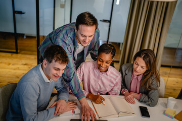 male director teach and help to his colleagues with new project