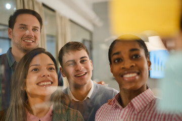 Diverse group of businesspeople brainstorming with sticky notes