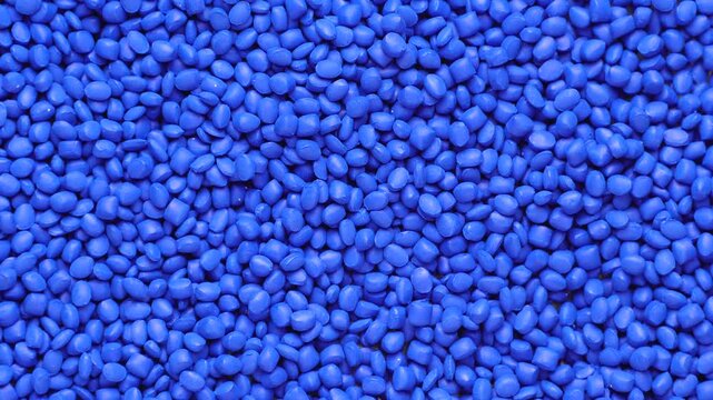 Blue polymer dye in granules, background texture