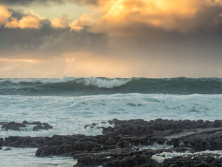 Powerful ocean waves and pastel sky. Nature scene with water and clouds. Nobody. Rough power and energy concept.