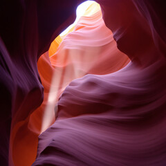 Stunning sunlight streaming through the intricate curves of Antelope Canyon, showcasing vibrant desert hues and natural beauty.
