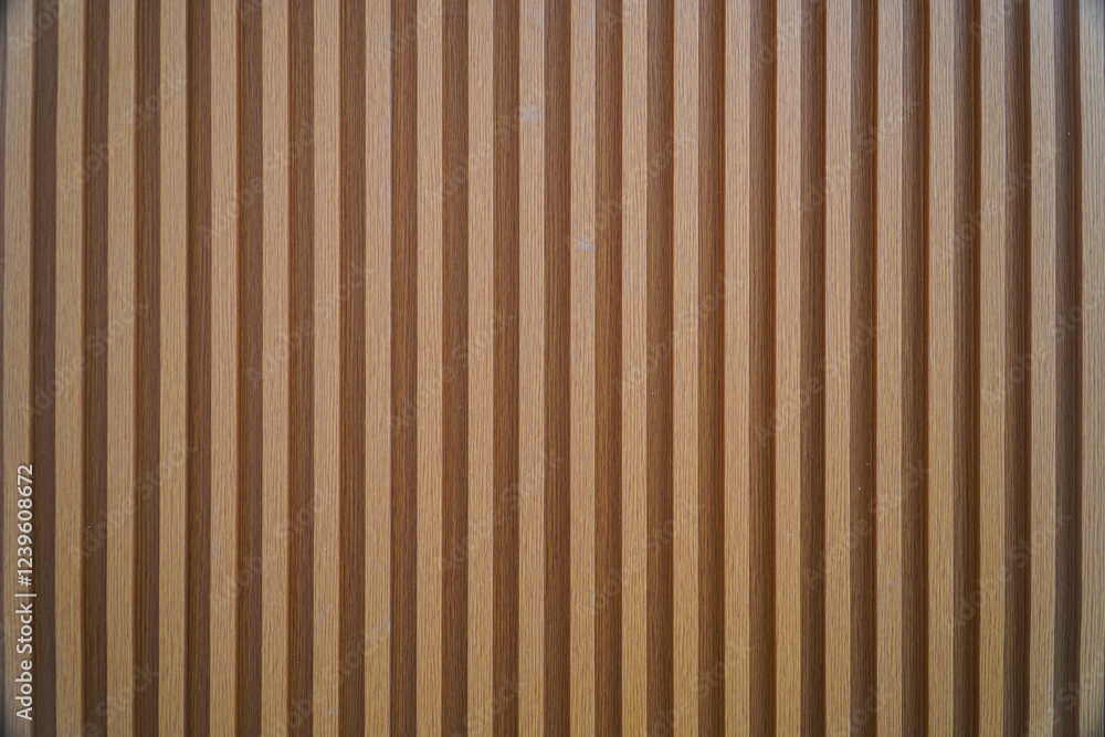 Poster close-up image of a wooden panel with vertical stripes. the texture is smooth and even, ideal as a b