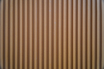 Close-up image of a wooden panel with vertical stripes. The texture is smooth and even, ideal as a...