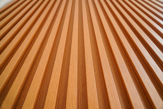 Close-up of a wood texture with parallel stripes. Abstract background. Striped Wooden Texture: Abstract Brown Lines Background