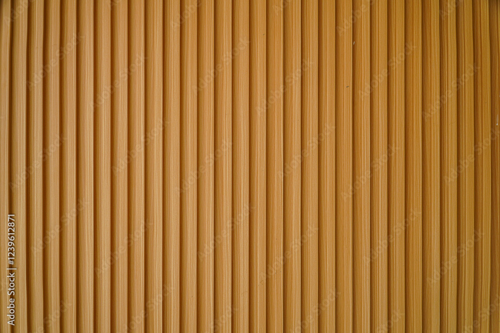 Poster close-up image of a wooden panel with vertical stripes. the texture is smooth and even, ideal as a b