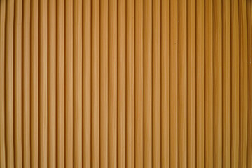 Close-up image of a wooden panel with vertical stripes. The texture is smooth and even, ideal as a...