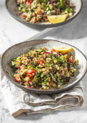 Buckwheat tabbouleh salad. Traditional middle eastern or arab dish. Levantine vegetarian salad.