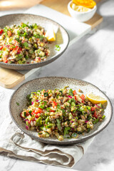Buckwheat tabbouleh salad. Traditional middle eastern or arab dish. Levantine vegetarian salad.