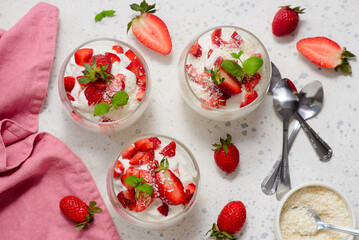 Coconut dessert with fresh strawberries in a glass .top veiw