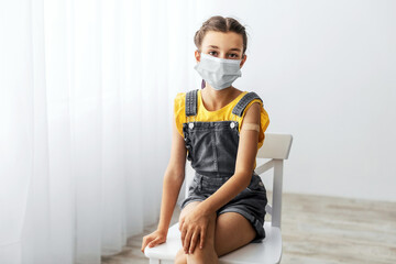 Required Vaccines for Child Care and School. Portrait Of Vaccinated Pupil Wearing Protective...