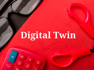 Calculator and glasses with the word Digital Twin on a red background. Business concept