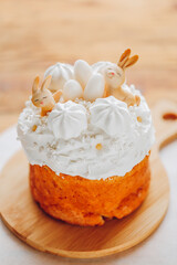 Easter Cake with Easter decor in light colors on a wooden table. Spring festive desserts. Catholic and Orthodox holidays table.Cute Bunny Decoration on Cake 