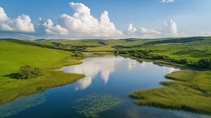 Fototapeta premium Serene Lake Landscape Aerial View of Green Hills and Blue Sky