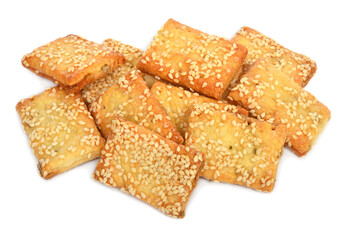 Sesame cookies heap isolated on white background