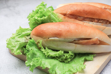 Banh Mi Vietnamese Sandwich, grilled pork and fresh vegetable. Street food. Freshly baked baguette