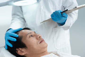 Specialist of hair check health of hair for Asian man, damaged hair, hair loss, thinning problem,...