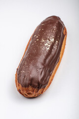 Savor a delectable chocolate eclair adorned with a glossy glaze, perfect for any type of dessert or snack occasion