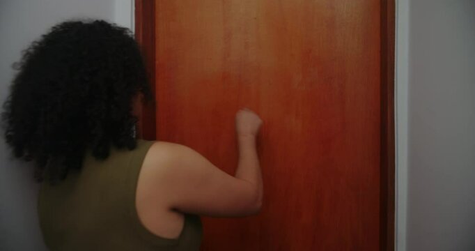 Teenage daughter resisting mother&rsquo;s demand for cellphone, smirking at the door, family struggle over smartphone use and boundaries