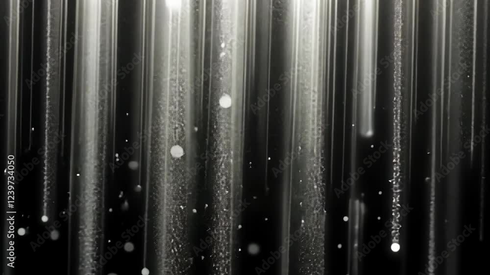 Poster flowing light beams create a mesmerizing pattern of sparkling particles in a darkened space