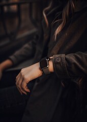 Fototapeta premium Smartwatch on a woman's wrist with black screen display for editing
