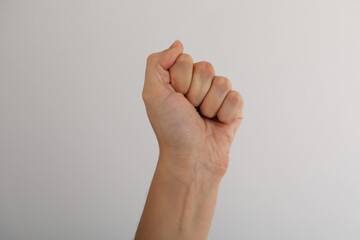 Woman with visible hand veins on light grey background, closeup