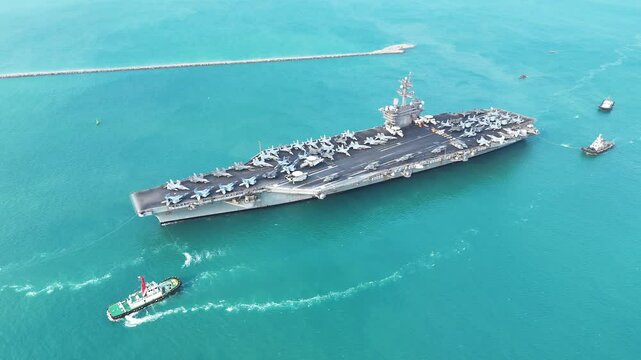 Nuclear war ship, Navy ship, Military navy. nuclear carrier running in the ocean. Military navy ship carrier full loading fighter jet aircraft for prepare troops