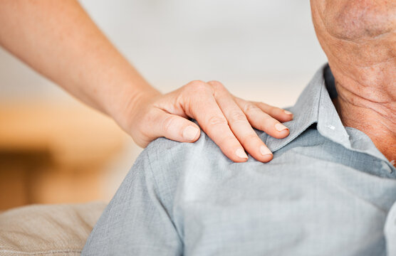 Closeup, hand and support with senior person for care or wellness in house, nursing home and retirement. Zoom, empathy and touch on shoulder for compassion, elderly and sympathy for healthcare help