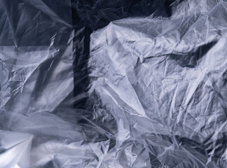 full frame abstract background of crumpled black plastic film bag