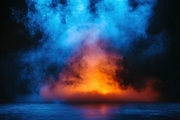Fototapeta premium Dramatic blue and orange smoke fills the frame, reflecting on a dark surface. Ideal for album art, fantasy, or abstract design projects needing a mysterious atmosphere.