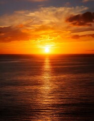 Obraz premium sunset over a tranquil ocean 