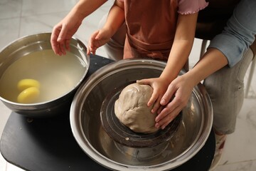 Hobby and craft. Mother with her daughter making pottery indoors, closeup