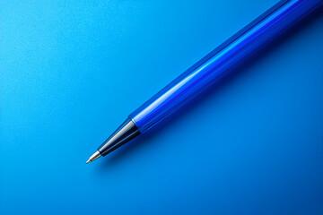 Blue Pen on Blue:  A simple, sleek, blue pen rests diagonally on a vibrant blue background, showcasing its minimalist design and classic functionality.