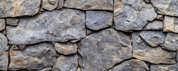 Fototapeta premium Gray Stone Wall Texture: A Rustic Architectural Background