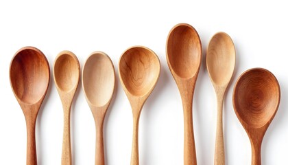 A collection of wooden spoons arranged in a row, showcasing their unique shapes and natural finish against a white background.