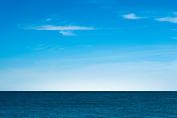 Nature of the beach and sea Summer with sunshine, sandy beaches, clear blue waters sparkling against the blue sky. On an island with good ecology and environment Background for summer vacation