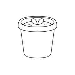 A white pot with a plant inside