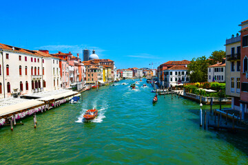 Fototapeta premium Villages along the river and boats passing through the village center