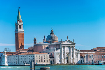 Fototapeta premium San Giorgio Maggiore is a 16th-century Benedictine church, designed by Andrea Palladio, and built between 1566 and 1610. It is a basilica in the classical renaissance style and its brilliant white mar