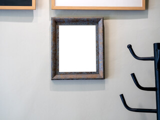 Mockup white blank space in vertical wooden square picture frame in private room at home. Empty...