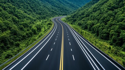 Fototapeta premium Economic infrastructure two-lane highway through majestic mountains with scenic natural landscape