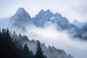 Fototapeta premium majestic alpine peaks piercing through mystical morning mist