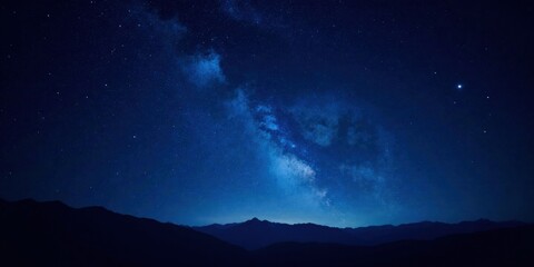 Serene Night Sky Over Majestic Mountain Range, Illuminated by a Galaxy of Sparkling Stars